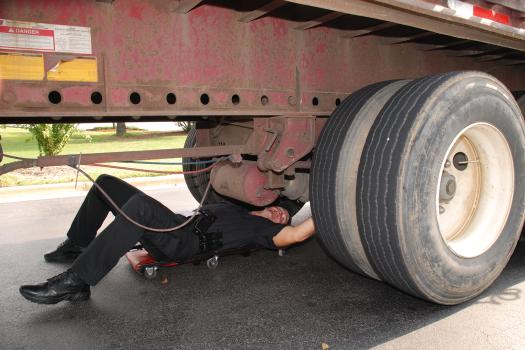 Inspecting under a truck